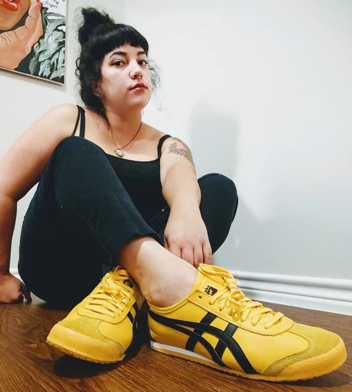 reviewer wearing yellow and black onitsuka mexico sneakers
