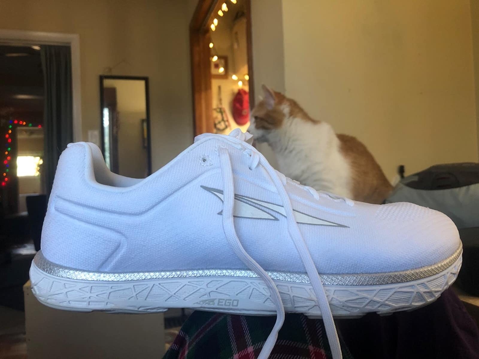 reviewer pic of white altra escalante shoe