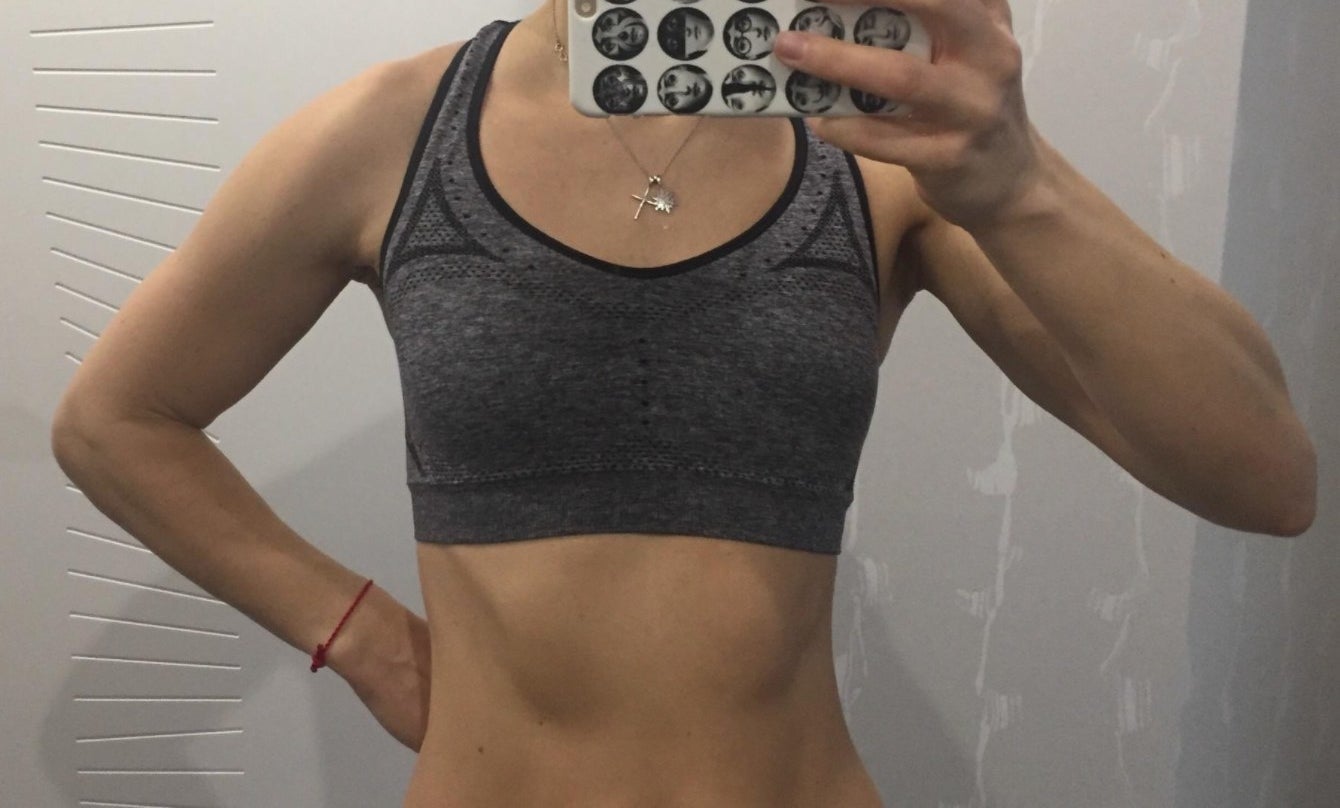 Reviewer in the wide-strap sports bra in gray 