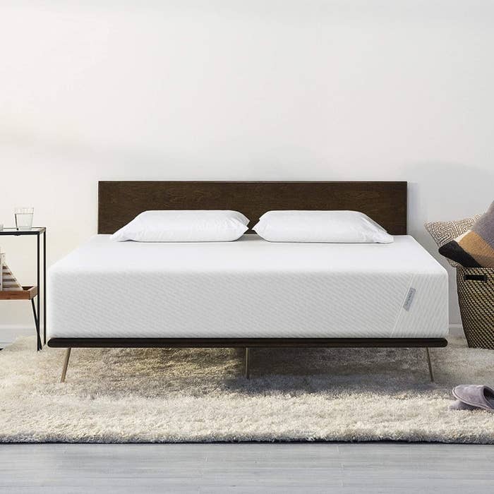 a queen mattress on a bed frame