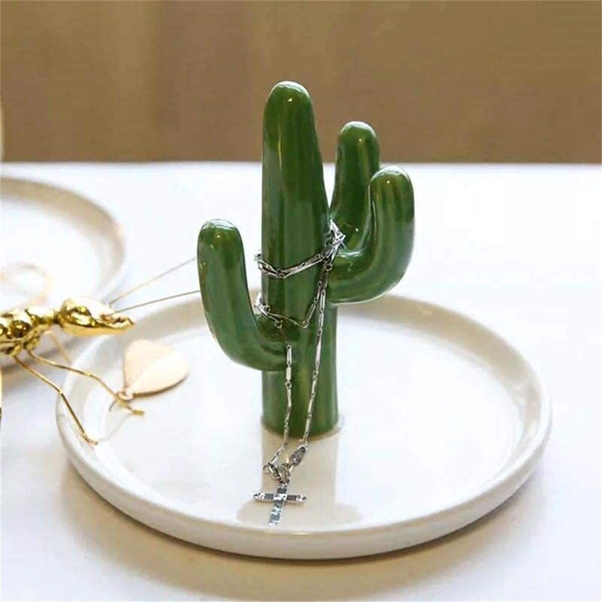 the cactus ring dish with four limbs to stack rings onto 