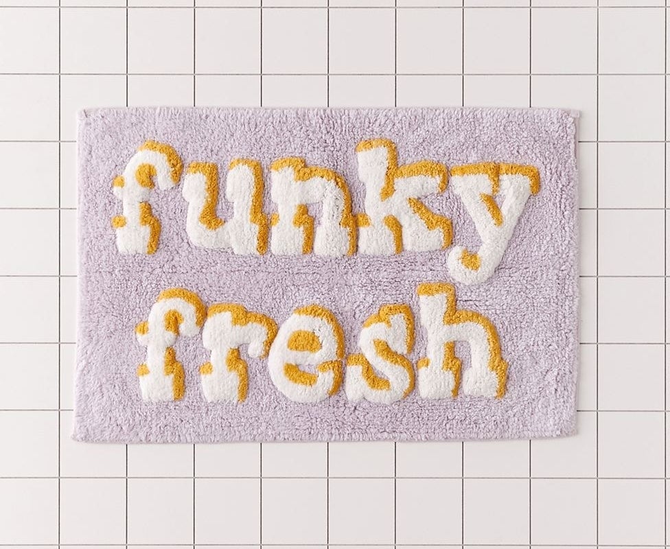 lilac and white bath mat with the words &quot;funky fresh&quot;