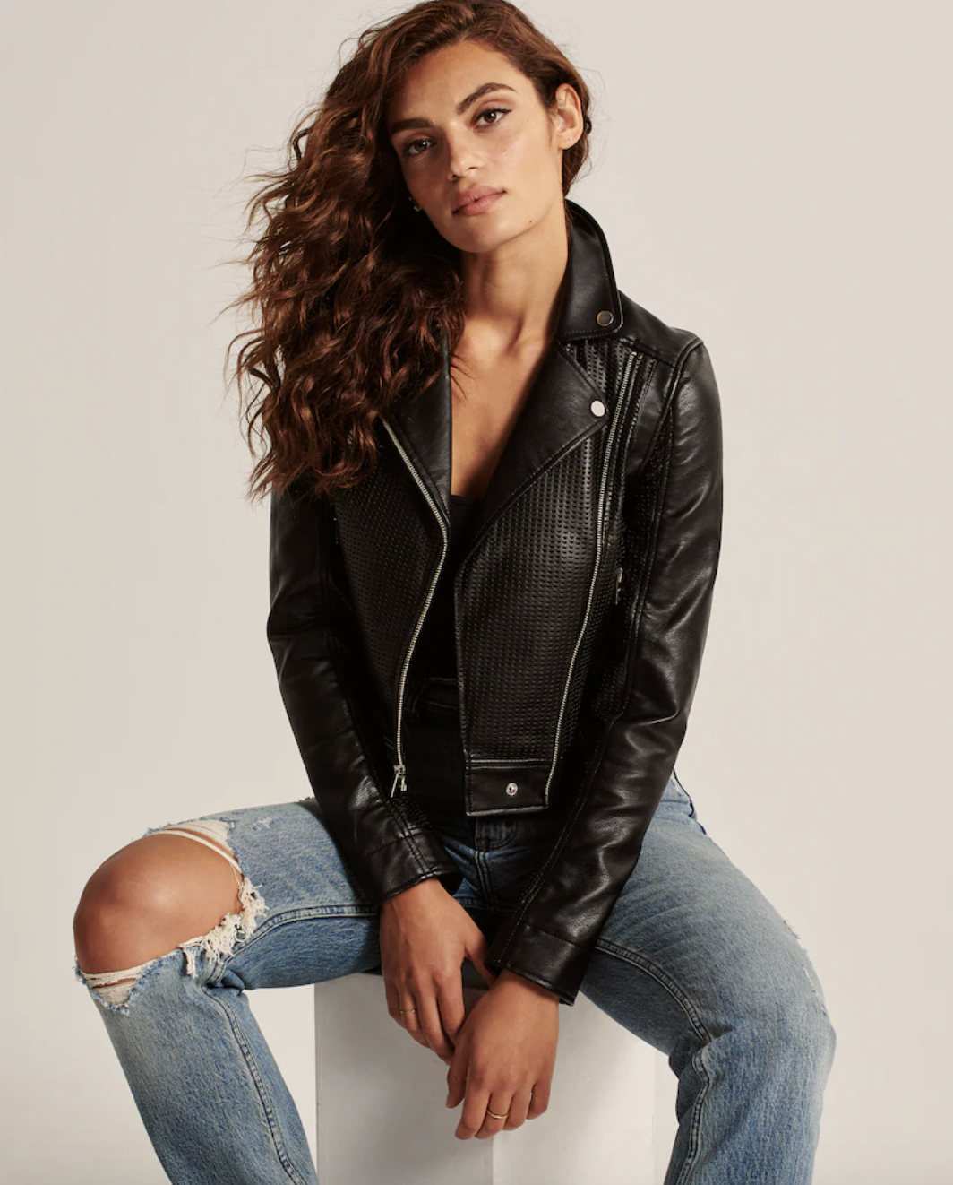 model wearing a faux leather moto jacket