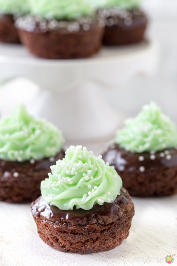Mini brownie bites with mint icing.