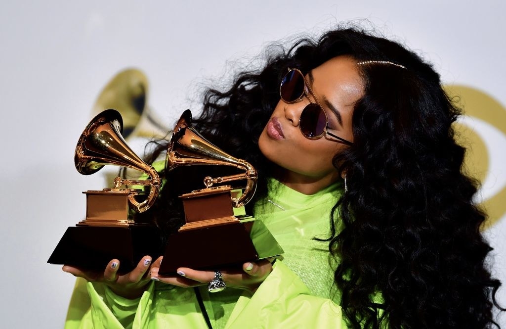 H.E.R., poses with her awards for Best R&amp;B Performance &quot;Best Part&quot; and Best R&amp;B Album &quot;H.E.R.&quot;