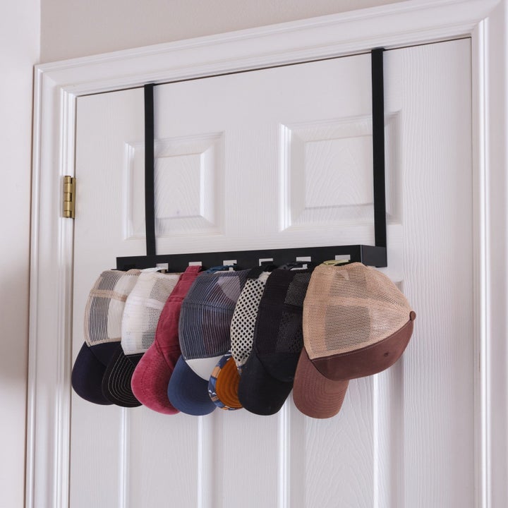 Over-the-door hat hanger with various hats hanging from loops