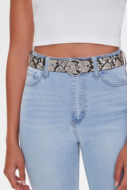 model wearing snakeskin belt with jeans