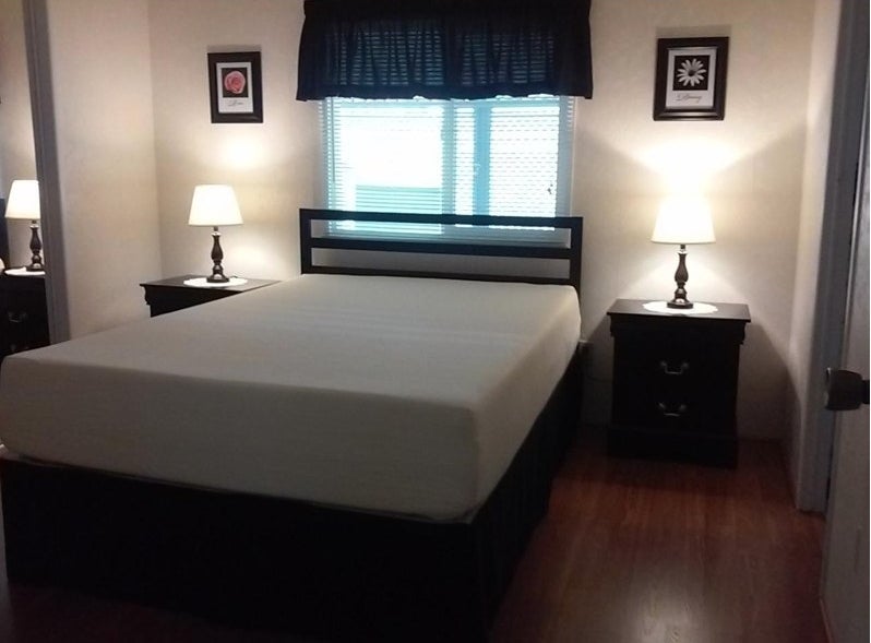 A full-sized mattress without sheets in a reviewer&#x27;s home