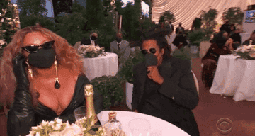 Jay-Z and Beyonce at a table at the Grammys 