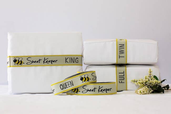 Three sheet sets with sheet keeper wrapped around