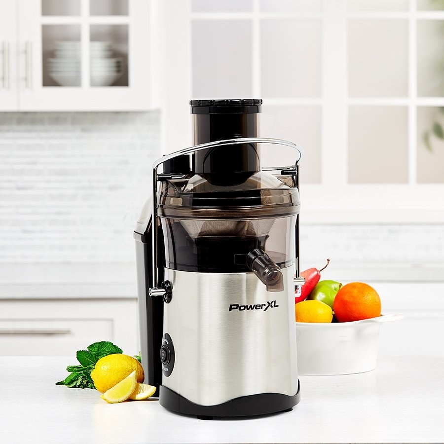 a black and chrome electric juicer