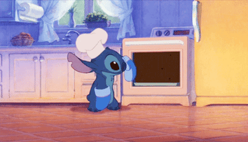 a small alien creature wears a chef hat and pulls a cake out of the oven