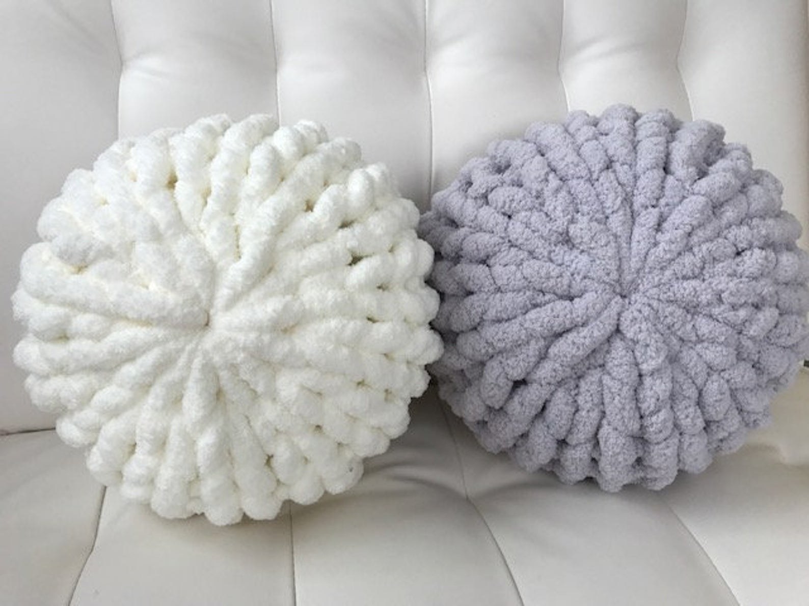 The white and grey thick ball pillows