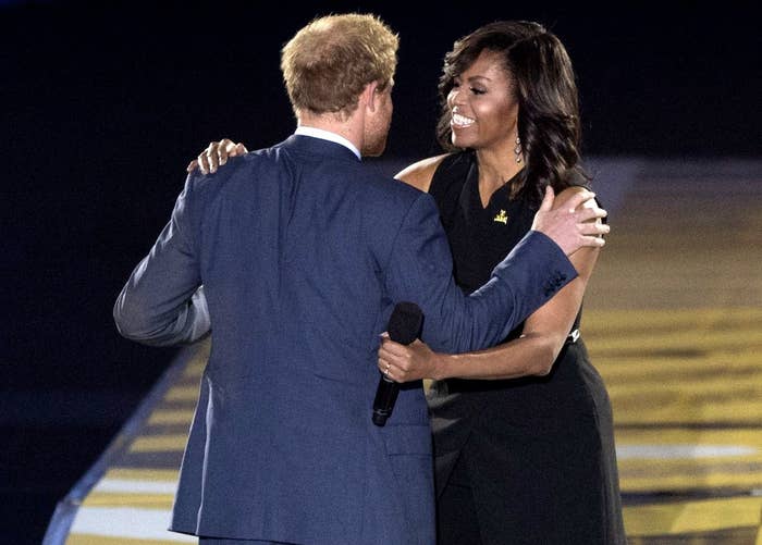 Michelle hugs Harry on stage