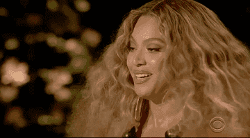Beyonce smiles while on stage 