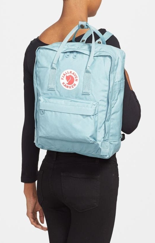 Model carries the sky blue kanken backpack