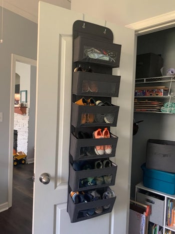Reviewer photo with over-the-door rack filled with shoes