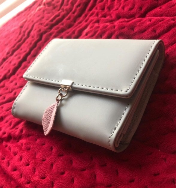 The wallet on a red blanket