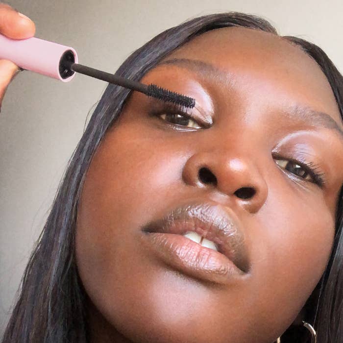 model applying the mascara