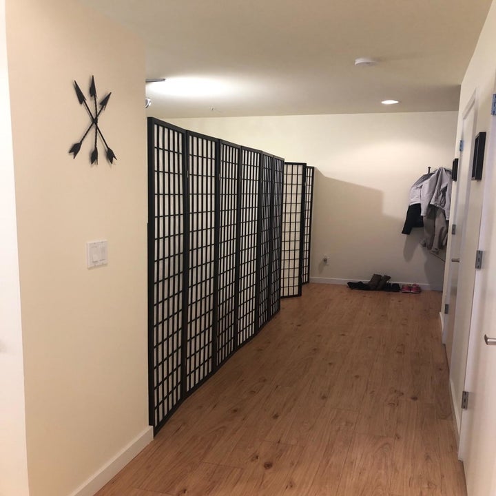 reviewer image of several shoji screen dividers forming a wall down a hallway