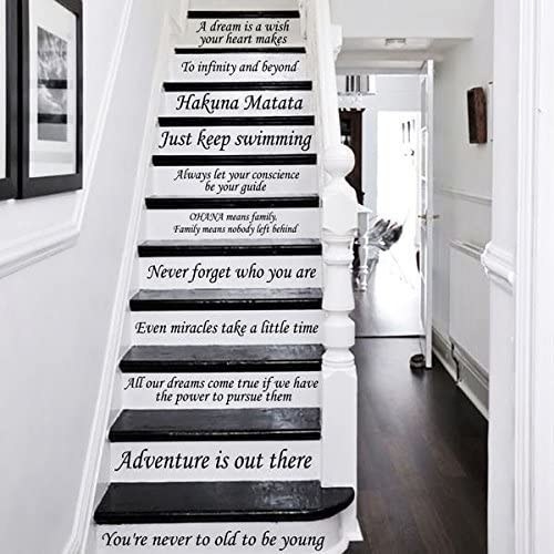 A white staircase with black Disney quotes decaled to the edges of them 