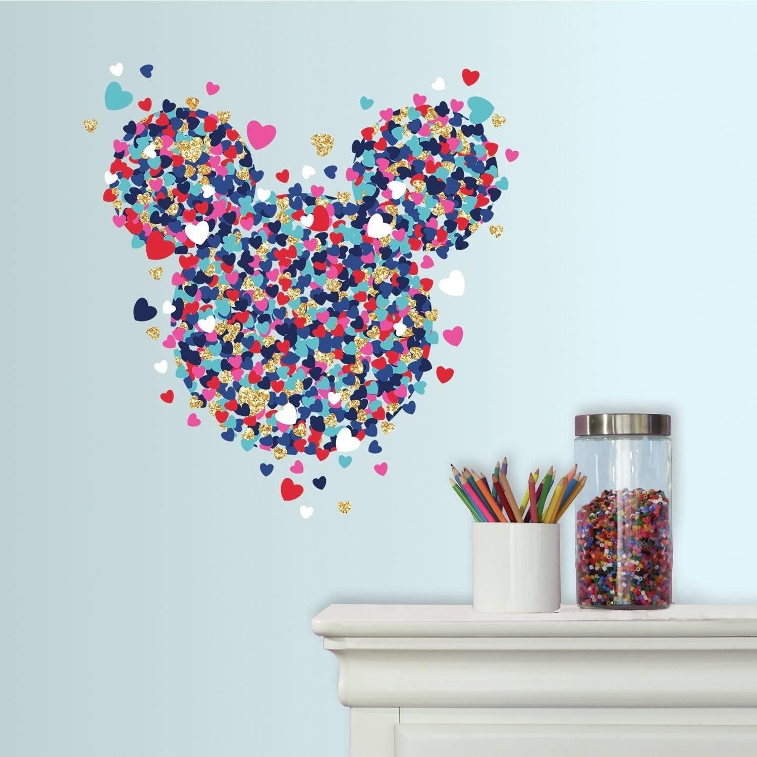 A multicolored glittery Mickey mouse wall decal made of up little hearts 