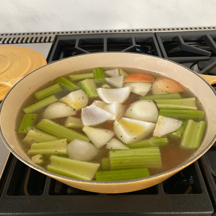 Vegetables in a soup pot.