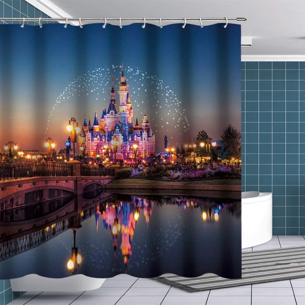 Shower curtain with image of lit up Disney castle at night 