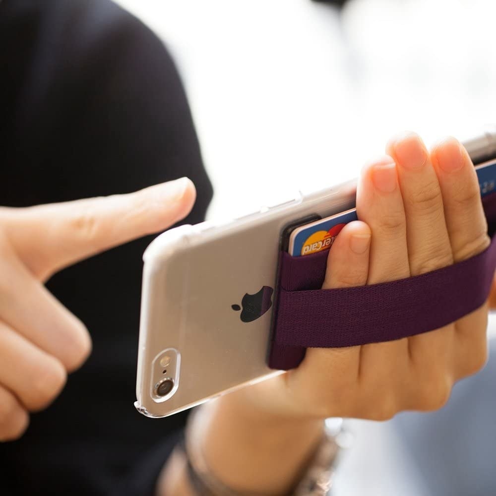A person holding their phone with the grip
