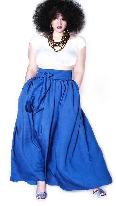 a model wearing a blue version of the long maxi skirt