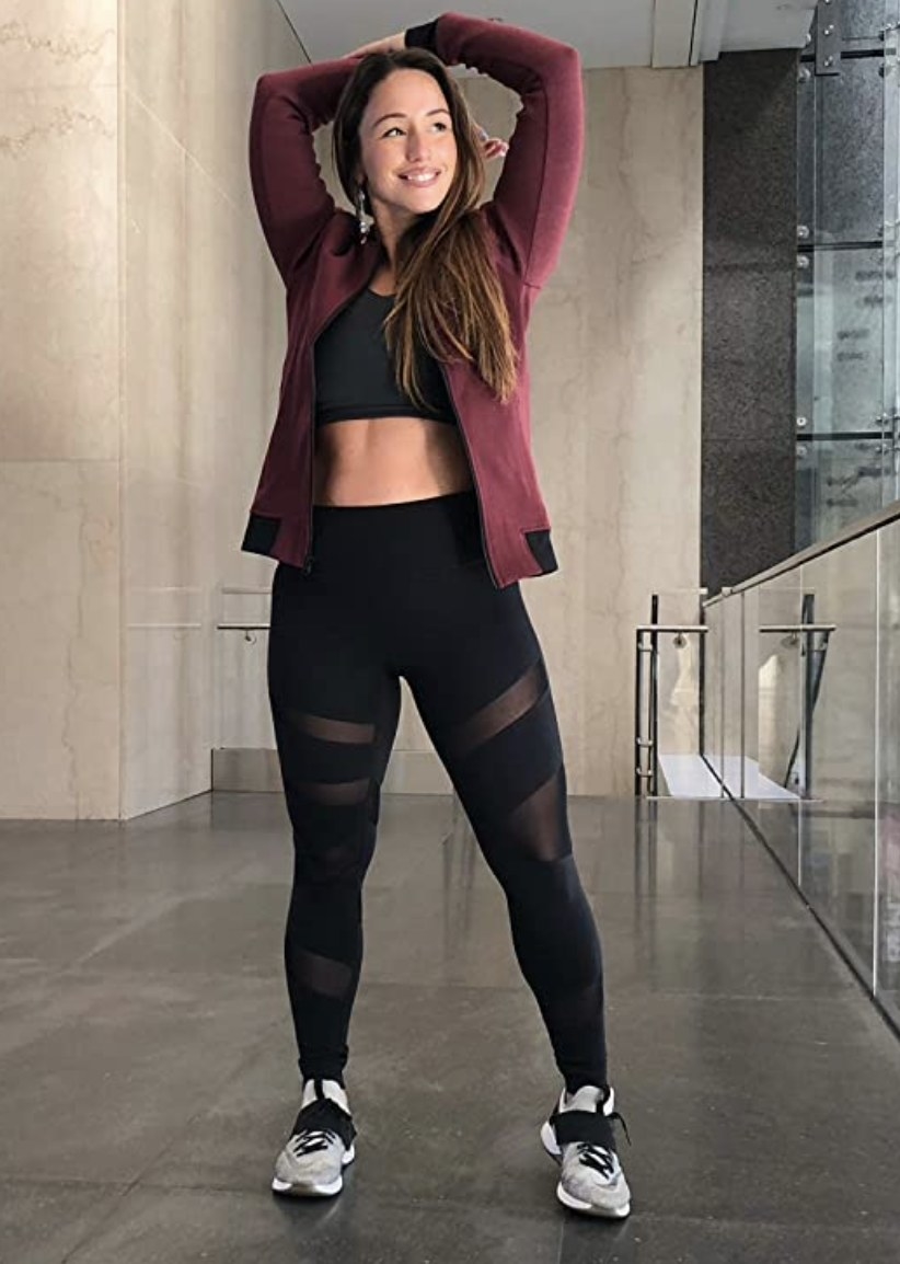 A girl standing in a pair of black mesh leggings
