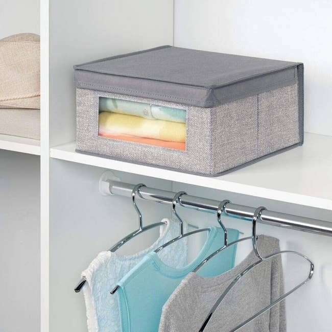 Stackable storage box placed on closet shelf