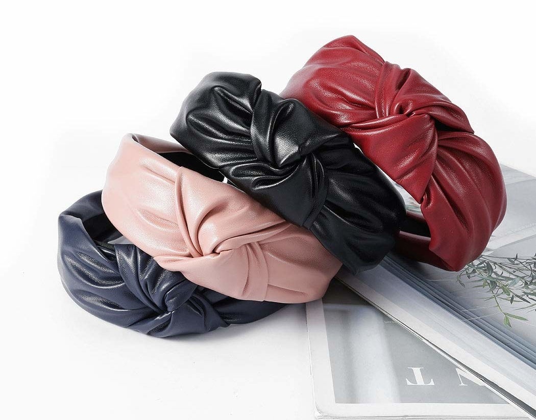 four faux leather headbands stacked on top of each other