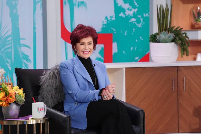 Sharon Osbourne sits in a chair on an episode of The Talk