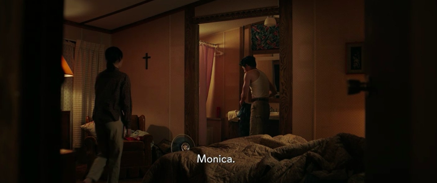 Jacob and Monica talking in their master bedroom.