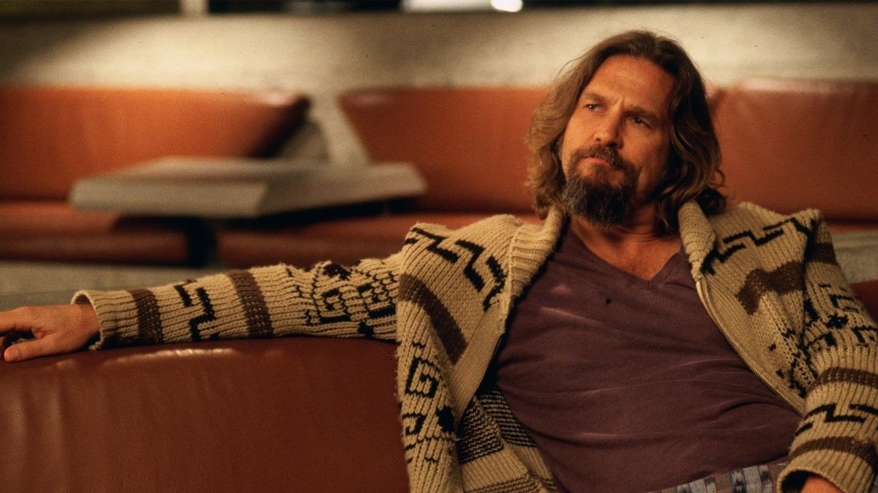 Jeff Bridges as The Dude, sitting in a bowling alley