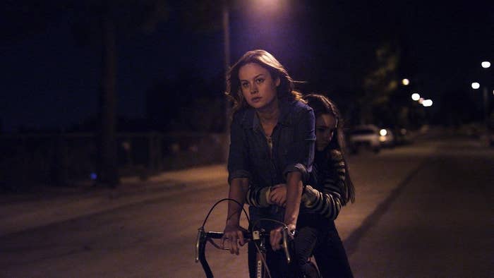 Brie Larson's character rides a bike with Kaitlyn Dever's character