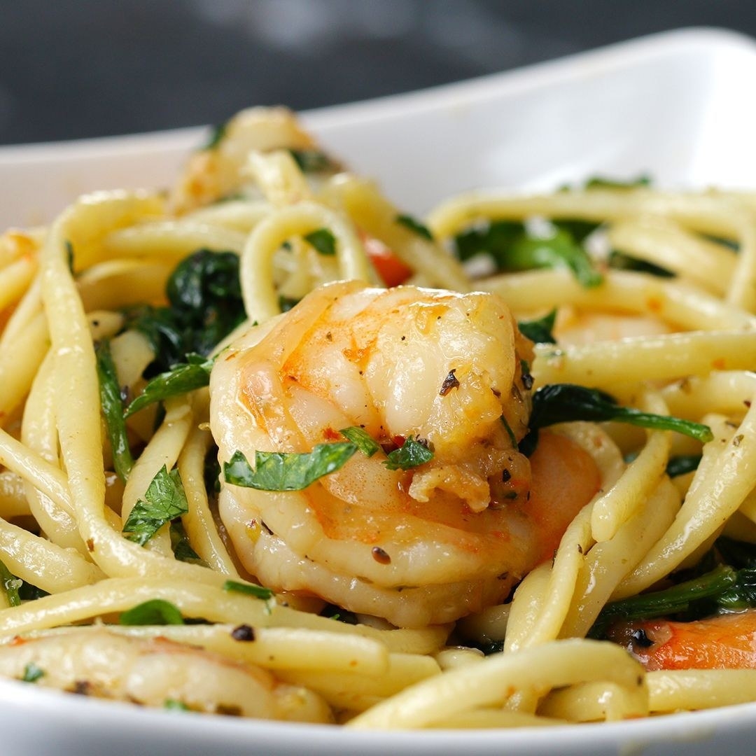 Shrimp pasta on a plate, garnished with fresh parsley