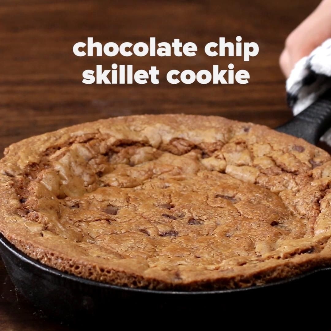 A just-baked chocolate chip cookie in a cast iron skillet