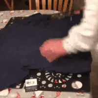 Gif of reviewer folding shirt with folding board