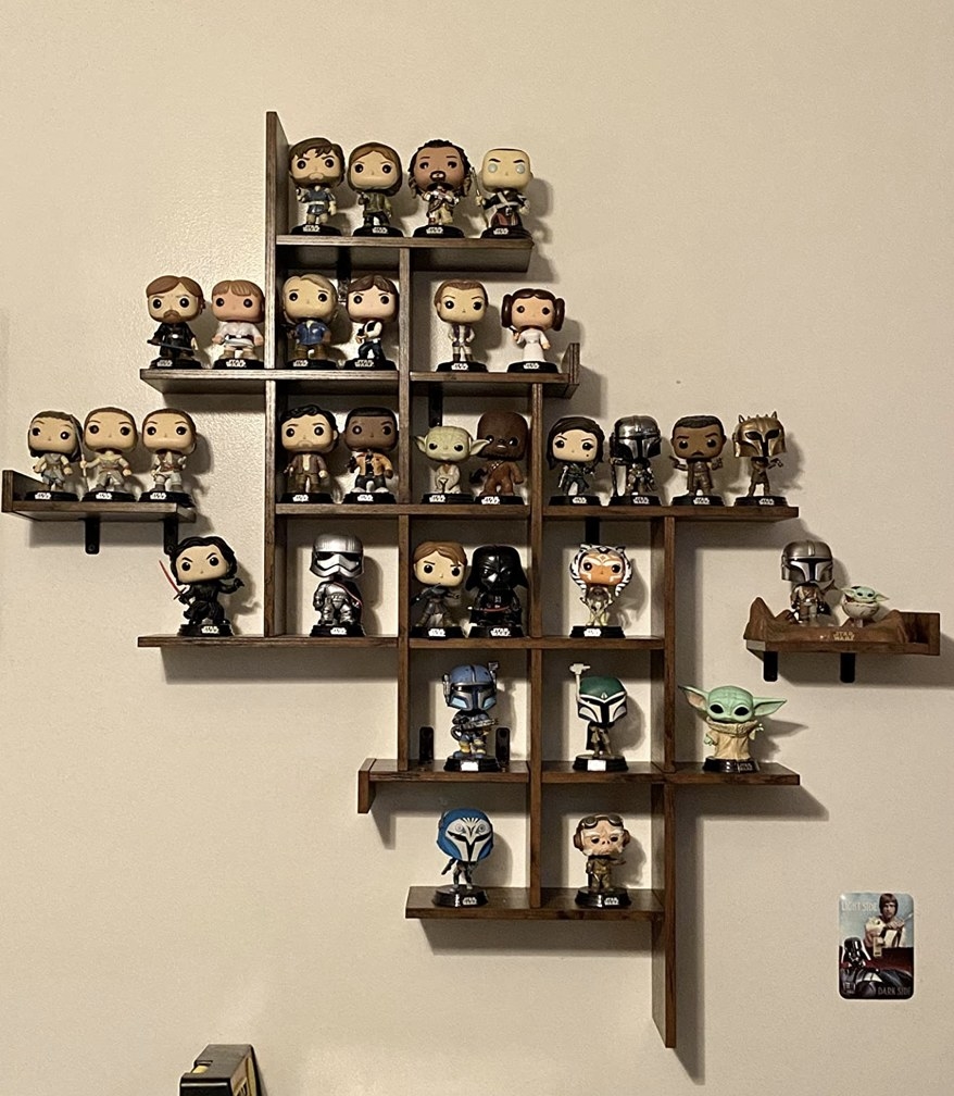 Reviewer&#x27;s image of floating shelves with knick knacks on it