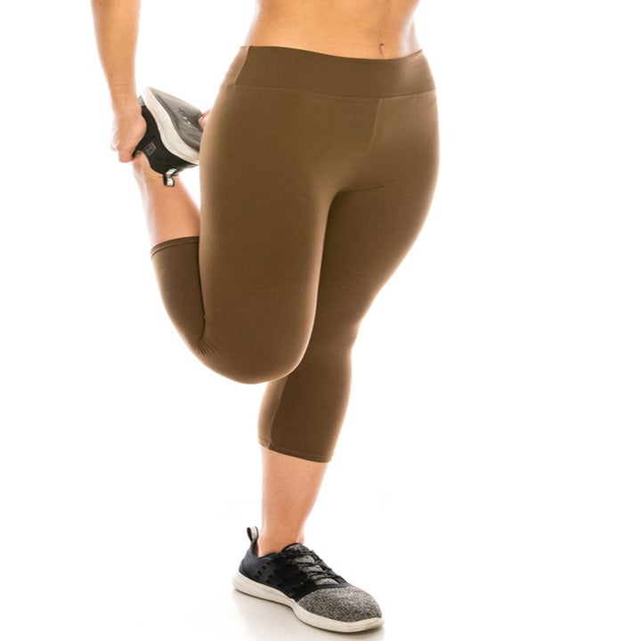 Model wearing capri-length leggings