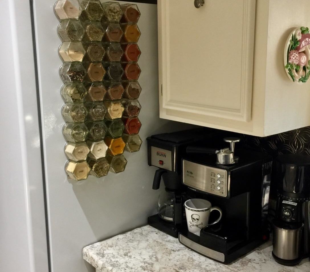 Magnetic spice canisters on refrigerator 