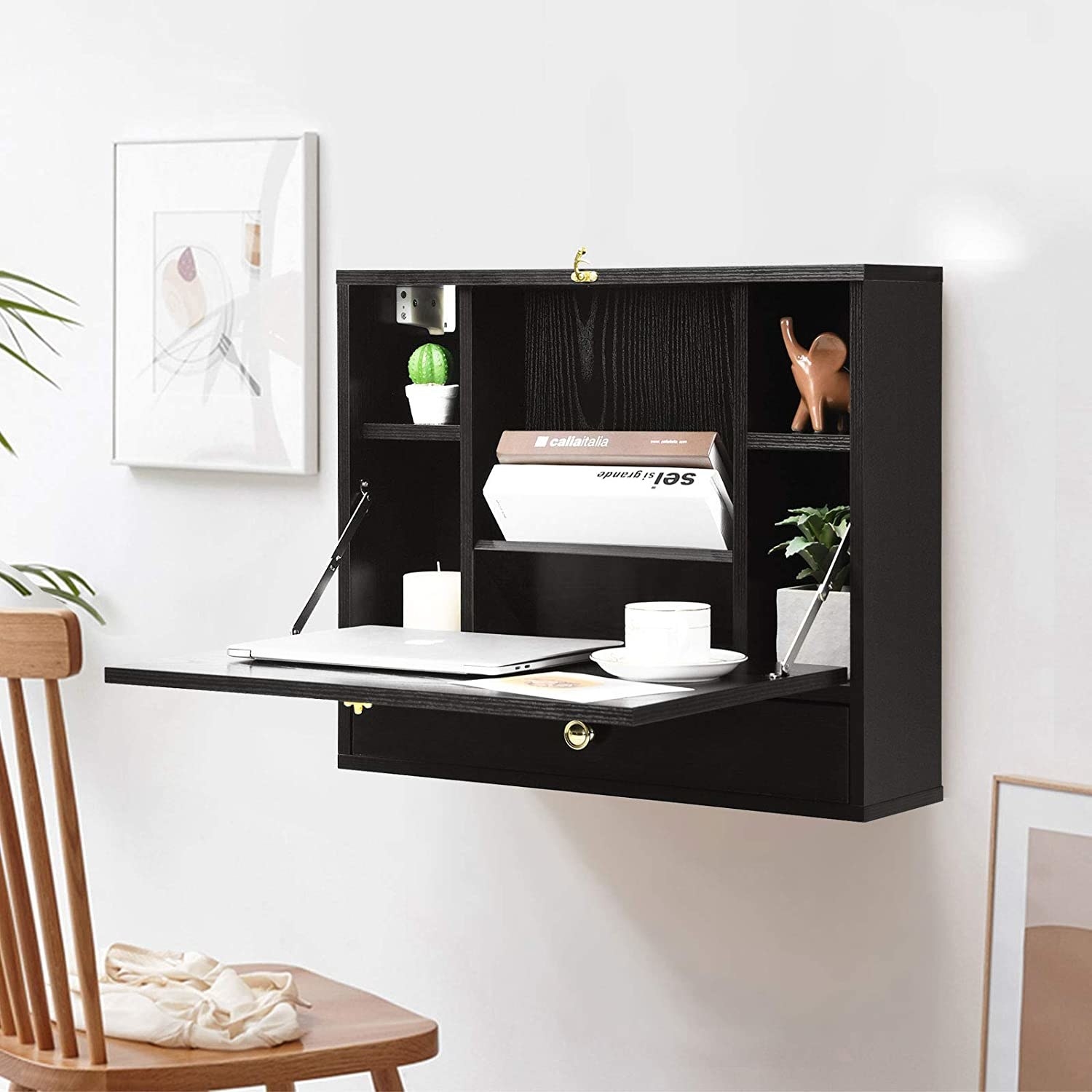 Square shelf system on wall with six spaces for storage and a pull down desktop 