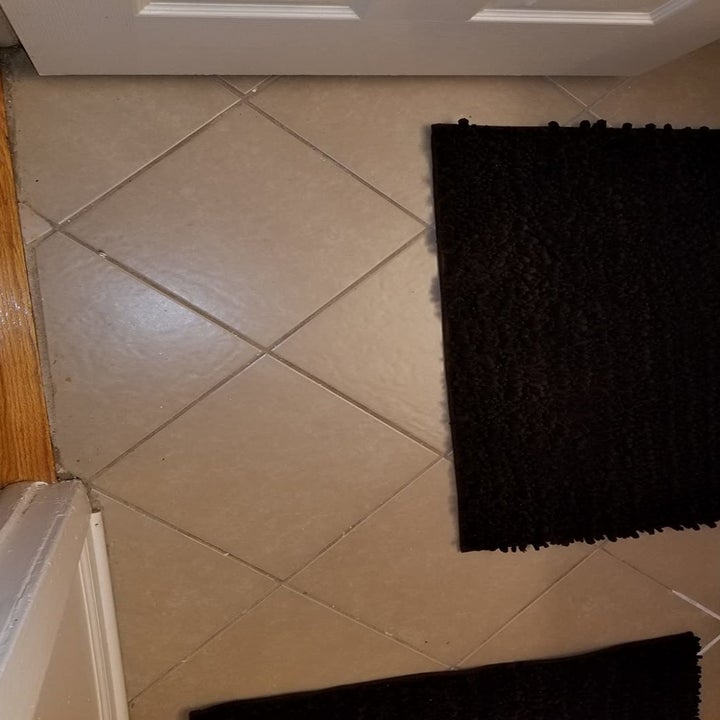 reviewer photo of dirty tile grout
