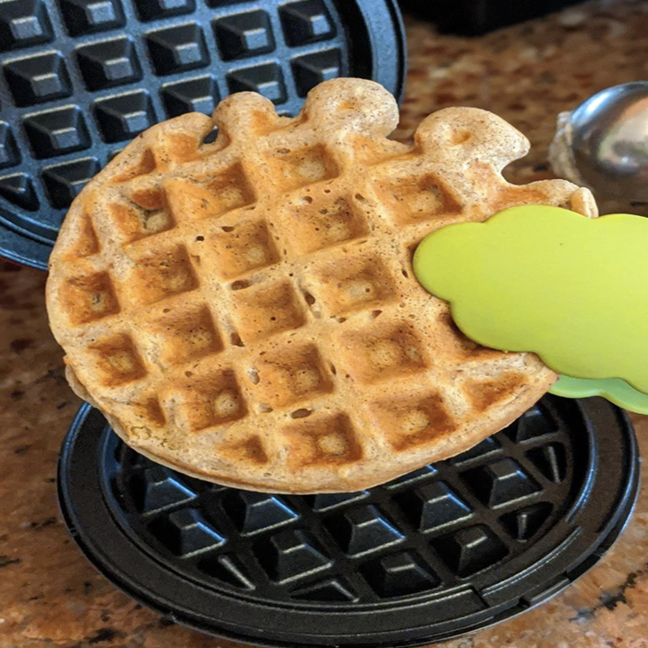 reviewer taking waffle out of the iron
