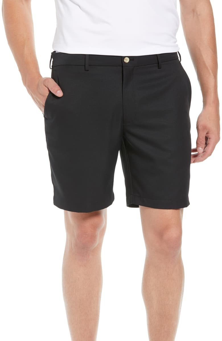 A reviewer wears the shorts in black