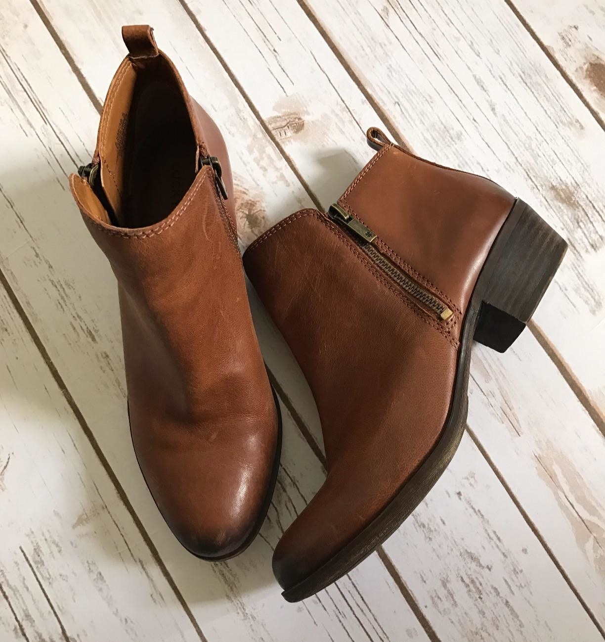 a reviewer photo of the booties in brown faux leather 