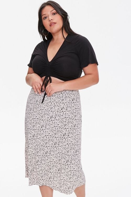 model wearing a spotted midi skirt