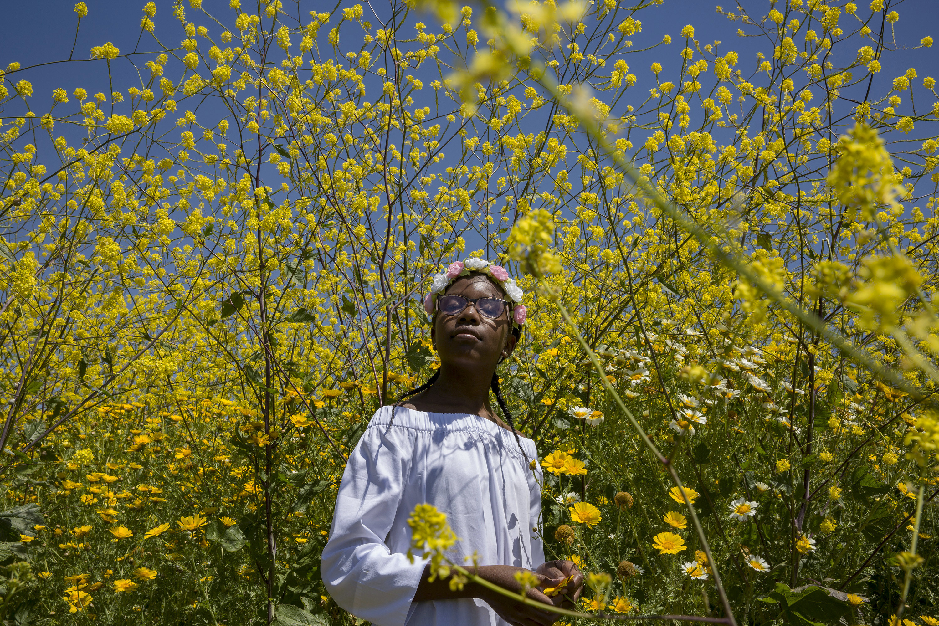 Latasha Harlins in a field of flowers